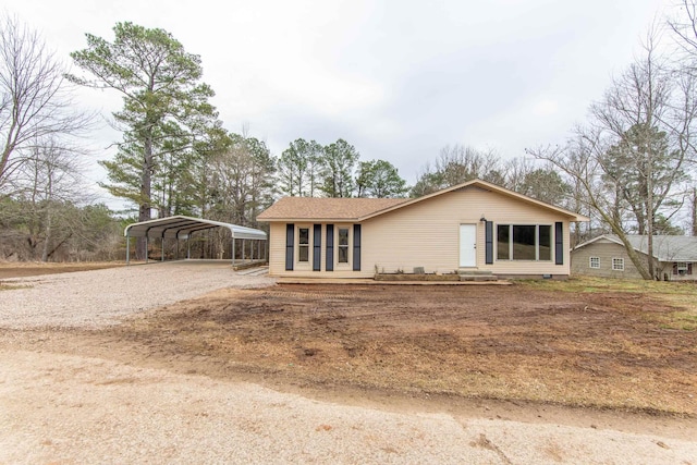 ranch-style house featuring a carport