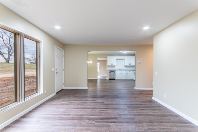 unfurnished living room featuring dark hardwood / wood-style flooring