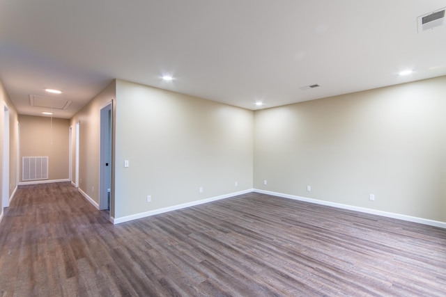 unfurnished room with dark hardwood / wood-style floors