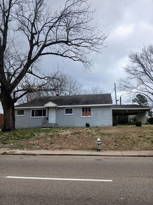 ranch-style house with a carport