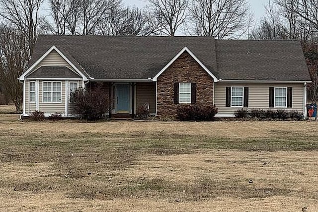 ranch-style house with a front yard