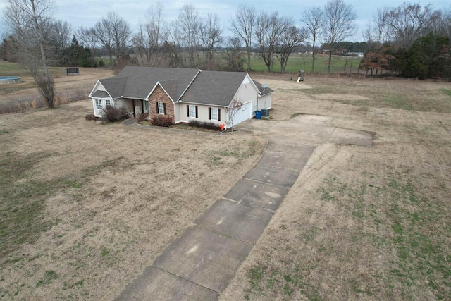 view of front of property with a garage and a front lawn