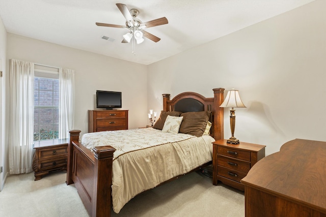 bedroom featuring ceiling fan and light colored carpet