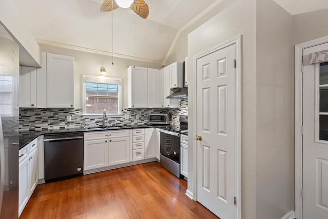 kitchen with appliances with stainless steel finishes, sink, and white cabinets