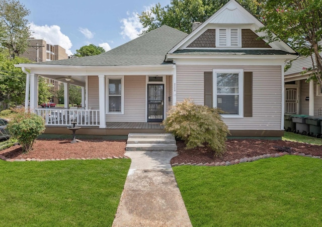 view of front of property with a porch and a front yard