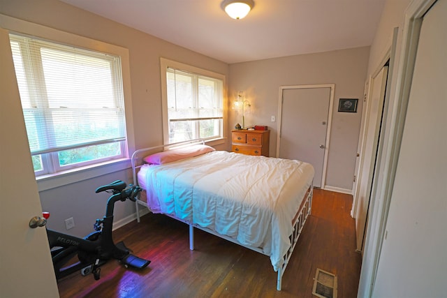 bedroom featuring dark wood-type flooring