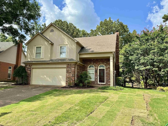 view of front facade featuring a garage and a front yard