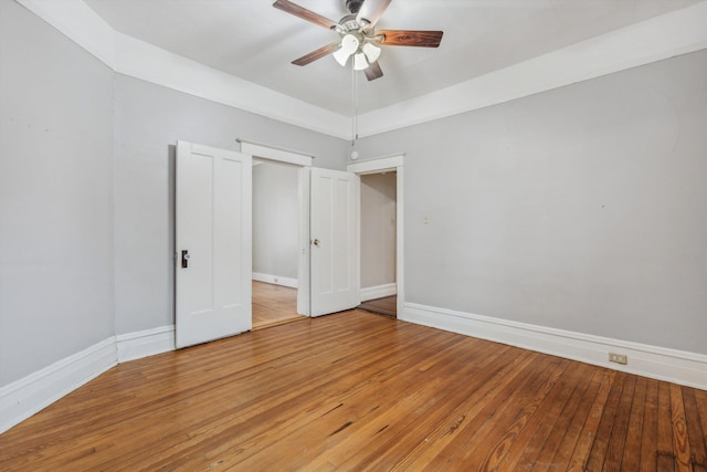 unfurnished bedroom with wood-type flooring and ceiling fan