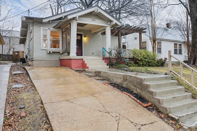 bungalow-style home featuring central AC unit and covered porch