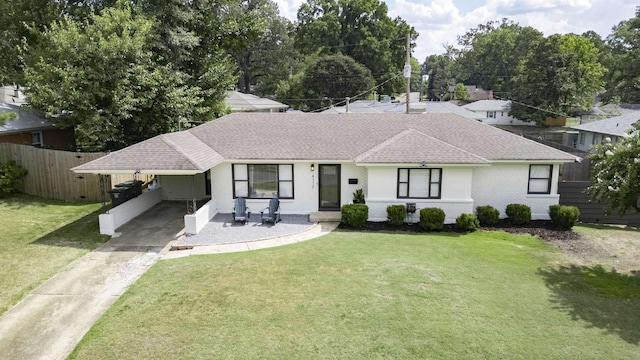 4117 Hilldale Ave, Memphis, TN 38117 - ranch-style house featuring a carport and a front yard
