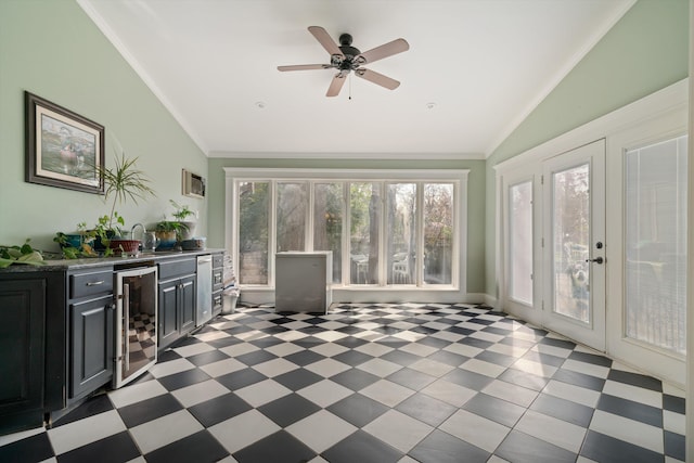 sunroom with ceiling fan, lofted ceiling, wine cooler, and indoor bar