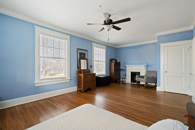 bedroom featuring ornamental molding, dark hardwood / wood-style floors, and ceiling fan