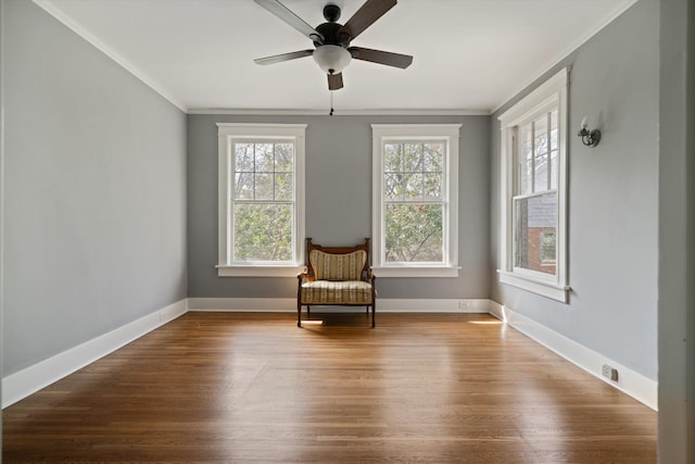 unfurnished room with hardwood / wood-style flooring, ornamental molding, and ceiling fan