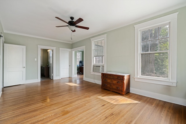 unfurnished room featuring cooling unit, crown molding, light hardwood / wood-style flooring, and ceiling fan