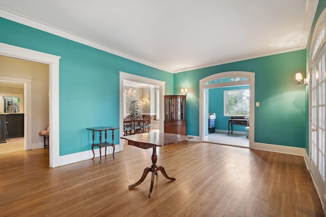 empty room featuring hardwood / wood-style flooring and ornamental molding