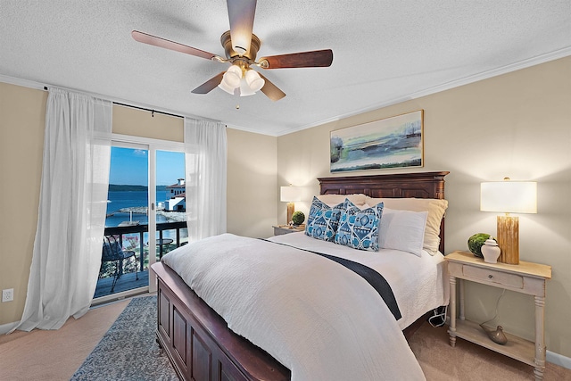 carpeted bedroom with ornamental molding, a water view, and access to exterior