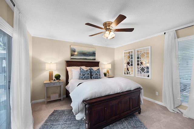 carpeted bedroom with crown molding, ceiling fan, and a textured ceiling