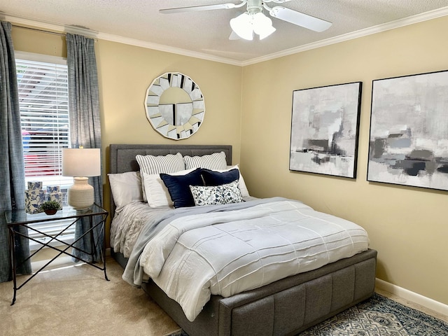 bedroom featuring crown molding, light carpet, a textured ceiling, and ceiling fan