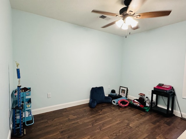 misc room featuring dark wood-type flooring and ceiling fan