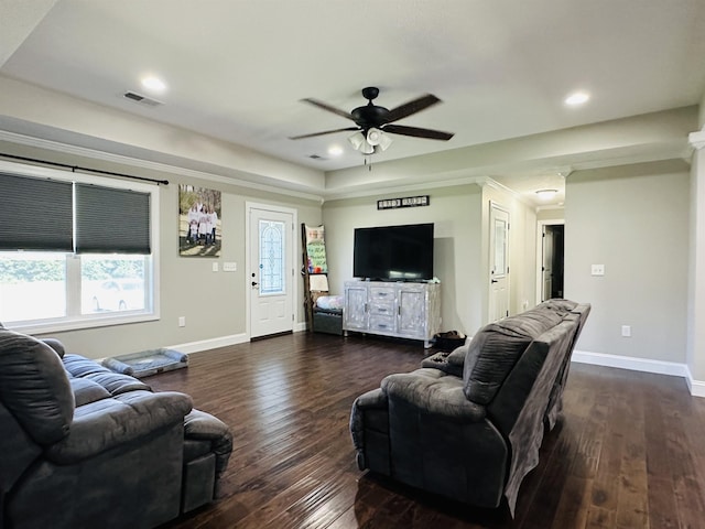 living room featuring dark wood-type flooring and ceiling fan