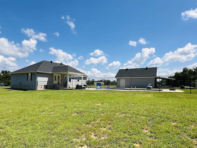 view of yard with a fenced in pool