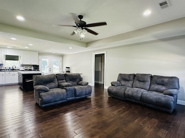 living room featuring french doors, ceiling fan, dark hardwood / wood-style floors, and sink