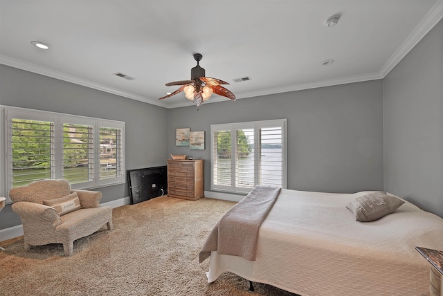 bedroom with ornamental molding, carpet flooring, and ceiling fan