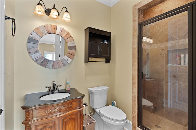 bathroom with vanity, toilet, and an enclosed shower