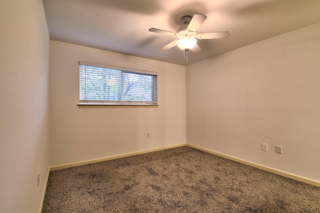 spare room featuring carpet floors and ceiling fan