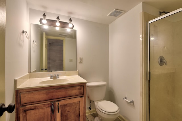 bathroom featuring vanity, toilet, and walk in shower