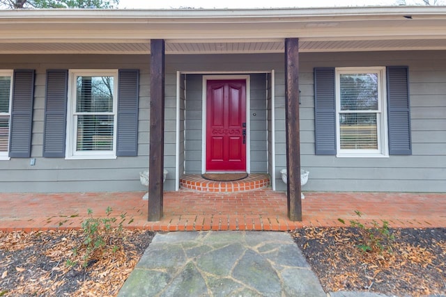 property entrance featuring covered porch