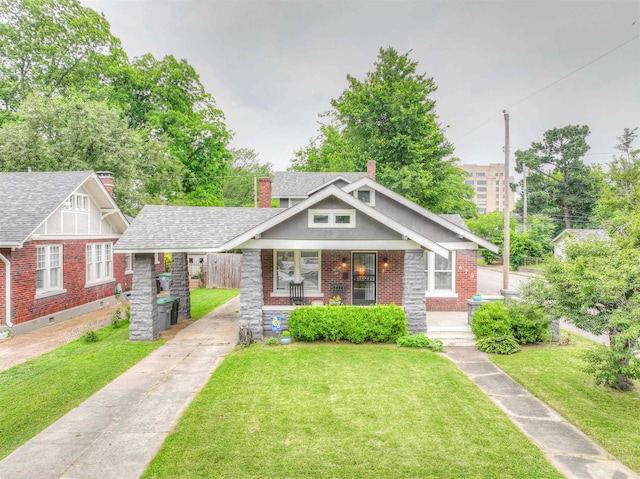 view of front of property with a front lawn and covered porch