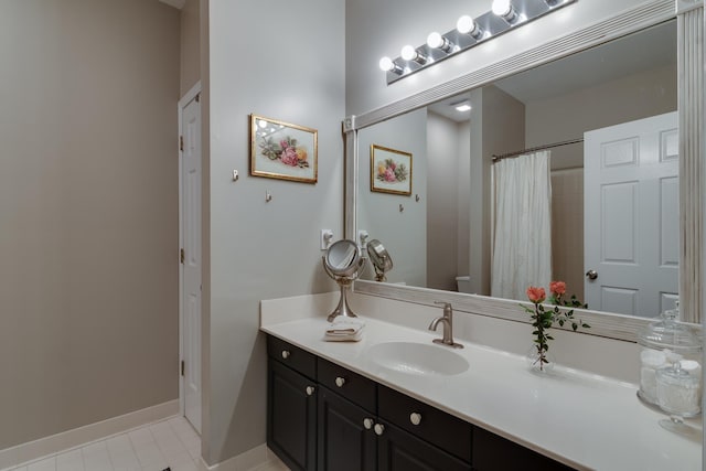 bathroom featuring a shower with curtain, vanity, and toilet