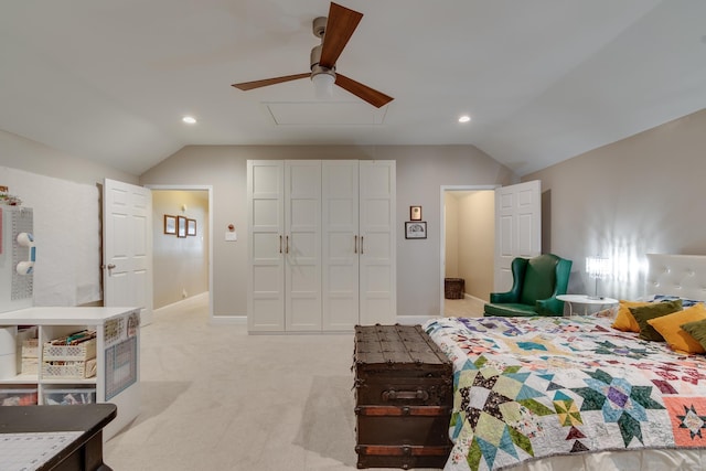 carpeted bedroom featuring lofted ceiling and ceiling fan