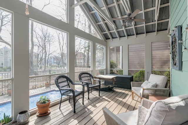 sunroom / solarium with vaulted ceiling and ceiling fan