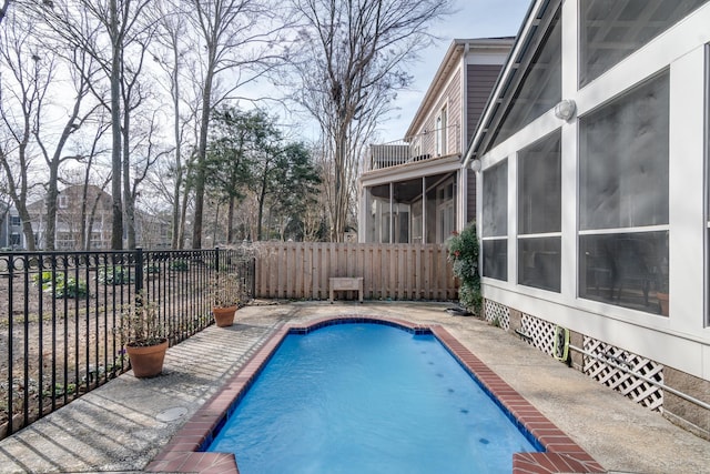 view of pool with a sunroom