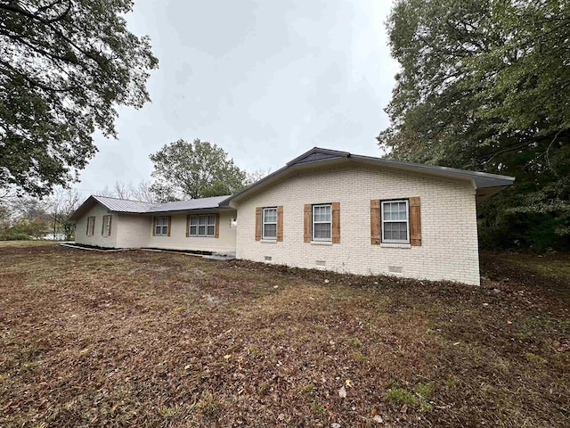 view of property exterior featuring a yard