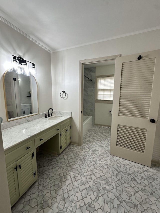 bathroom with vanity, ornamental molding, and tiled shower / bath