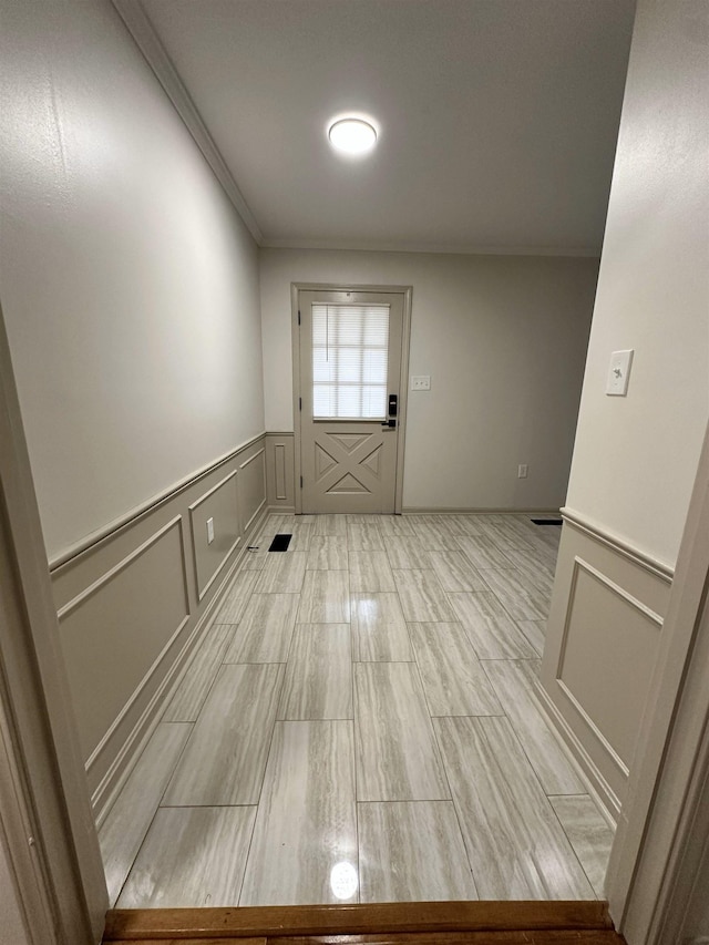 entryway with crown molding