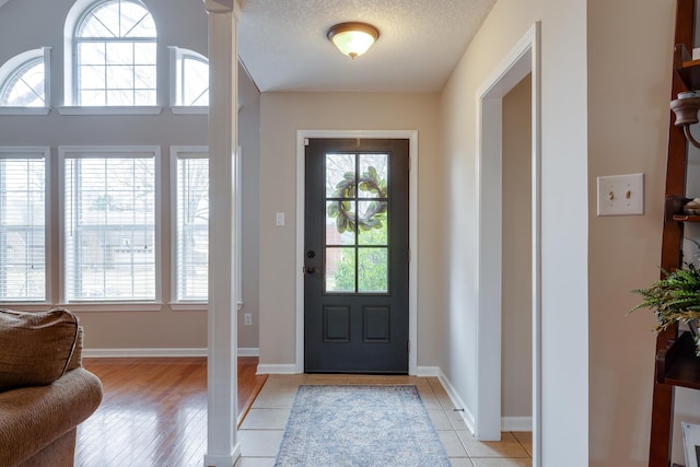 foyer featuring a textured ceiling