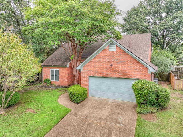 view of front of house featuring a garage and a front yard