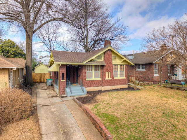 single story home with a front yard and a porch