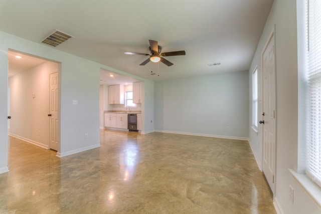 unfurnished living room with ceiling fan