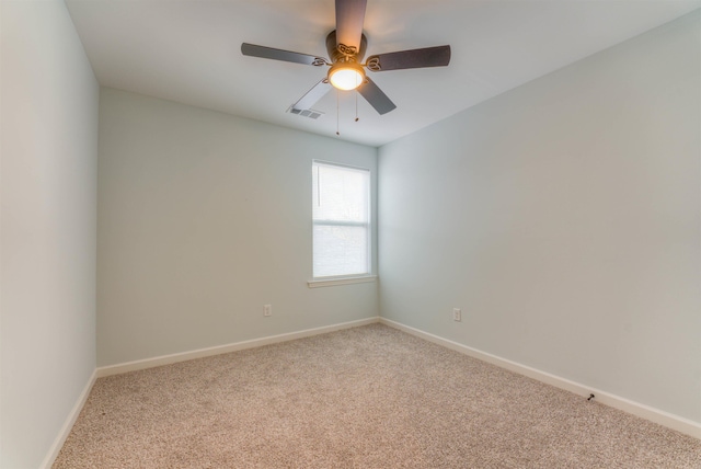 carpeted empty room featuring ceiling fan