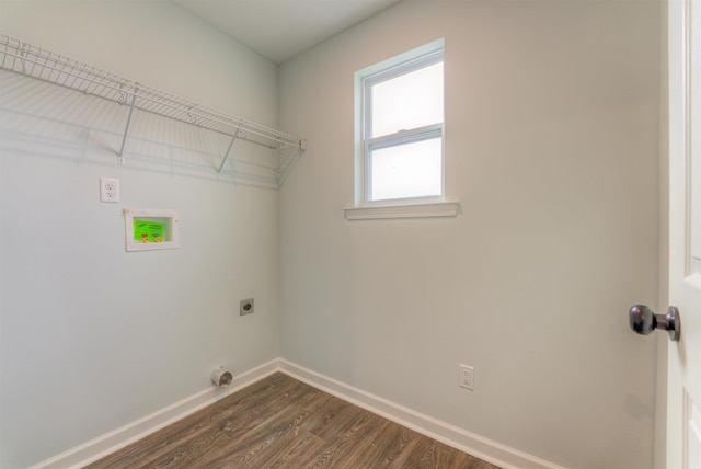 clothes washing area with dark hardwood / wood-style flooring and hookup for an electric dryer