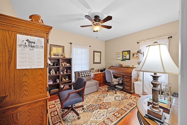 office featuring hardwood / wood-style flooring, ceiling fan, and plenty of natural light