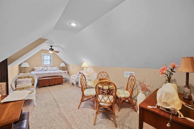 bedroom featuring lofted ceiling, light colored carpet, and ceiling fan