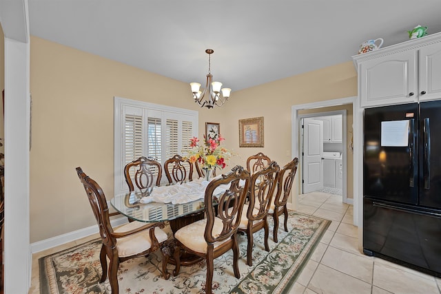 tiled dining area with a chandelier