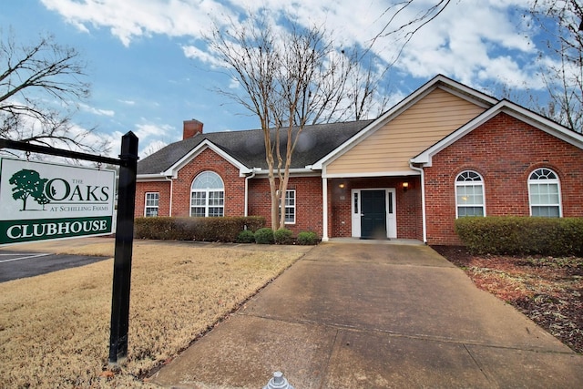 ranch-style home featuring a front yard