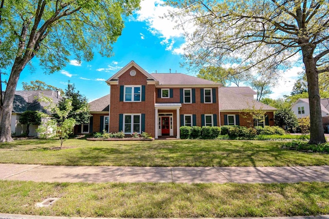 colonial home with a front yard